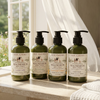 Magnesium lotion collection beside sunlit white sheer curtains