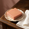 Pink Champagne Sparkle soap detail on an ivory ceramic dish